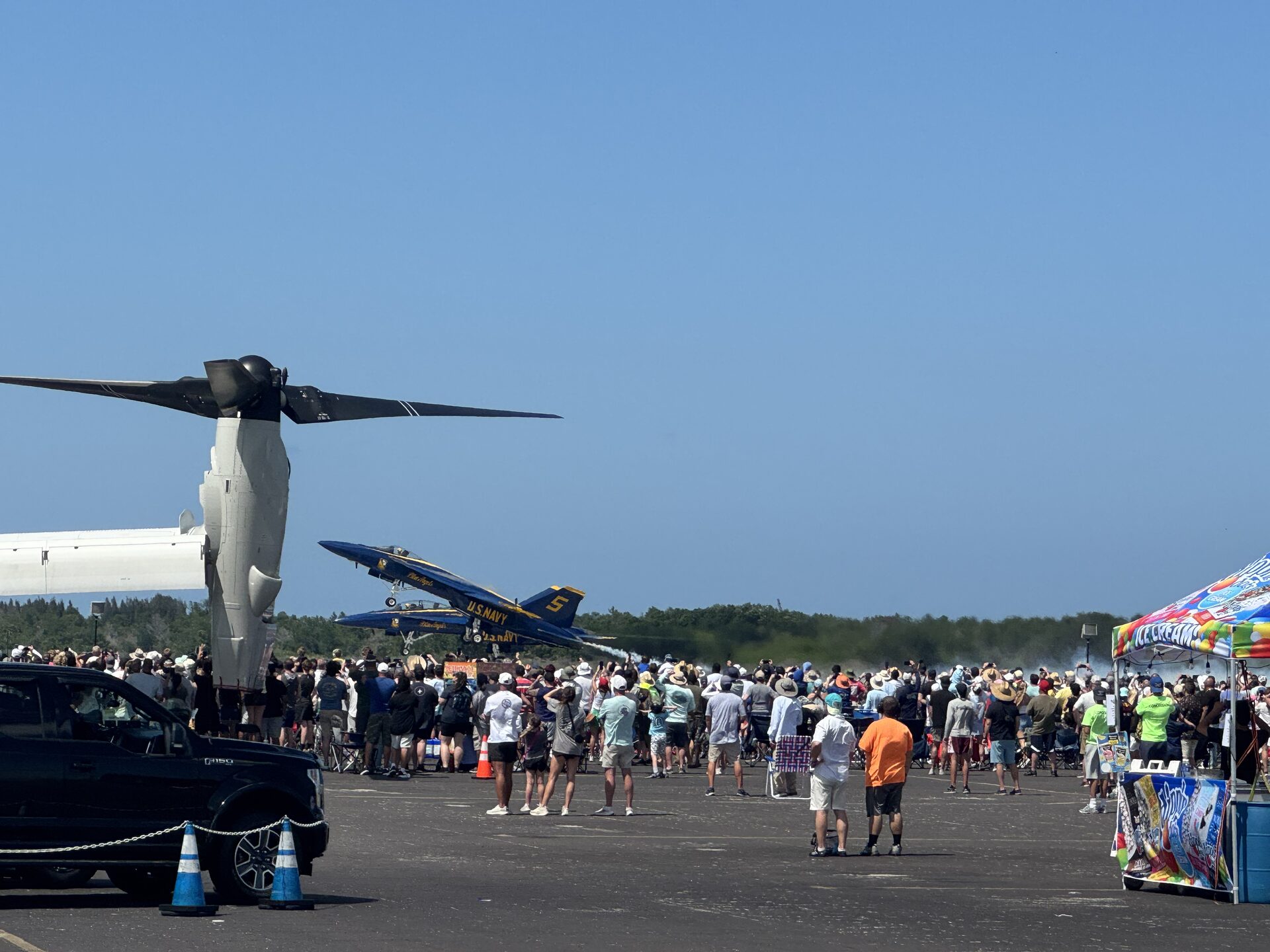 Blue Angels in front of a dense crowd