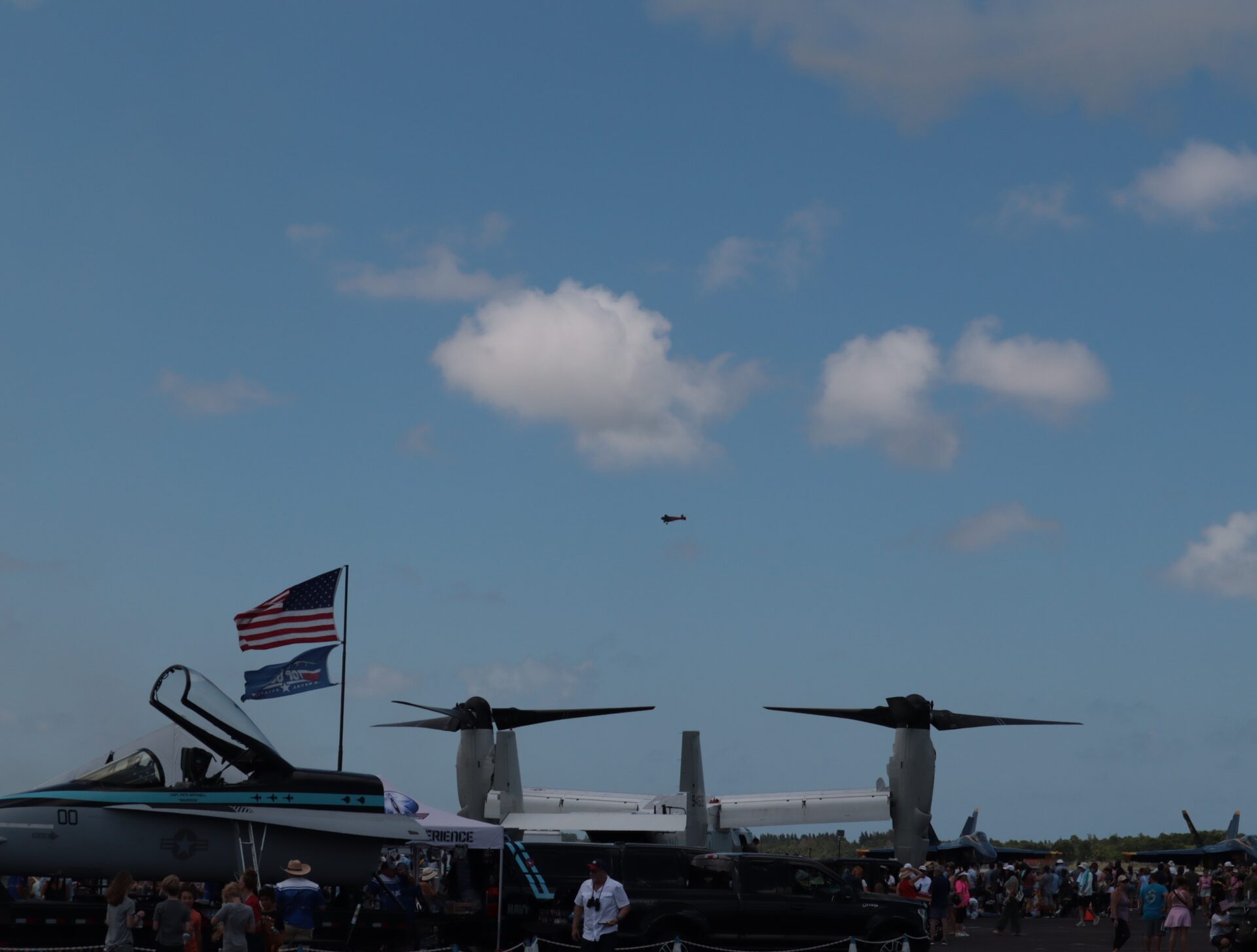 US flag and Top Gun pennant above a jet