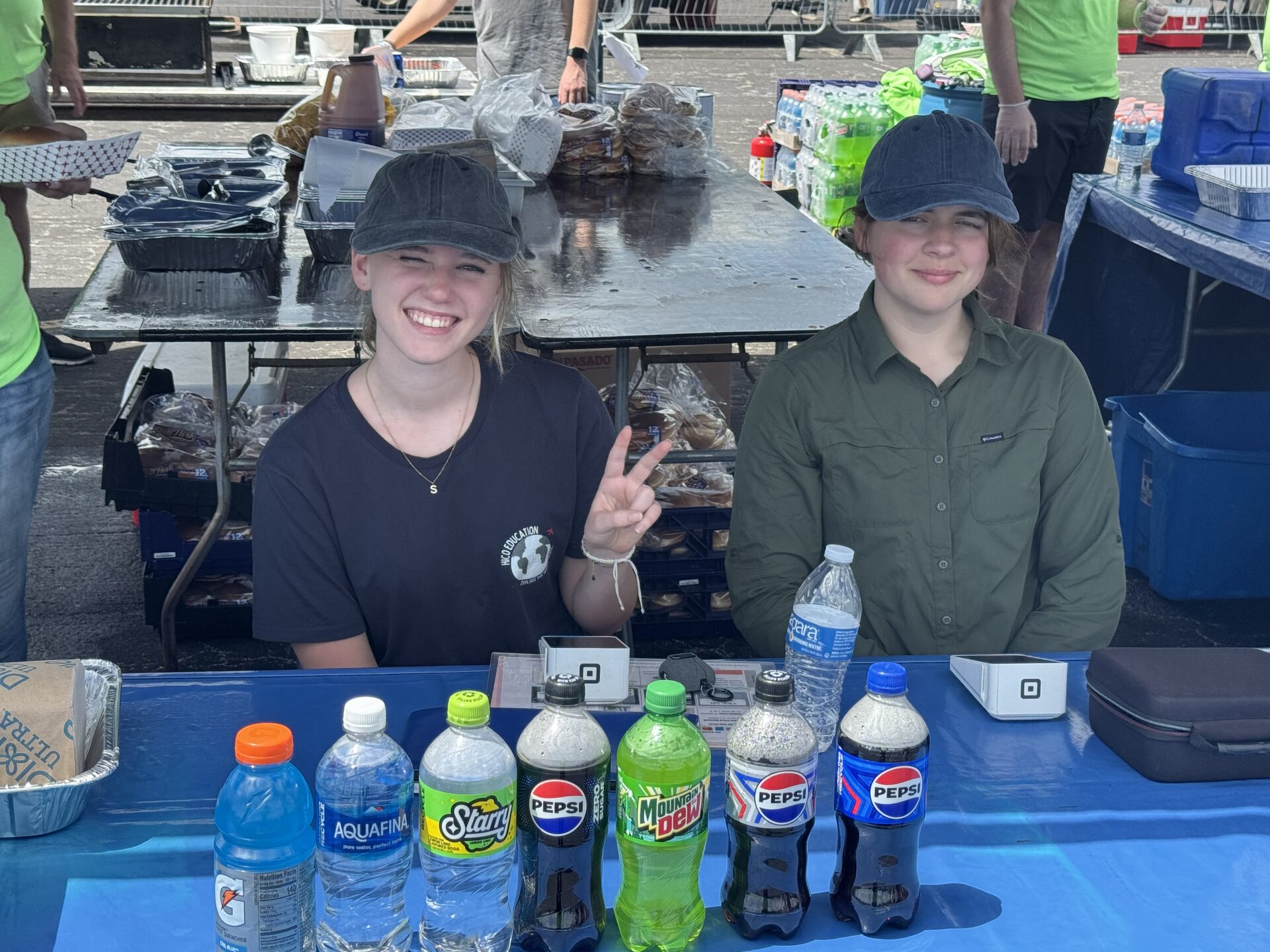 Two SIDO students at the drinks stand