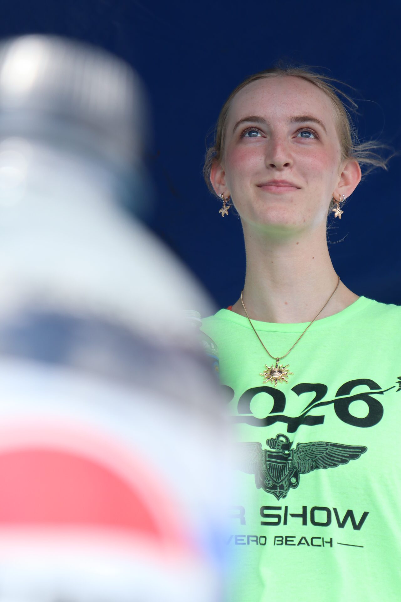 Student looking up at the sky during the air show